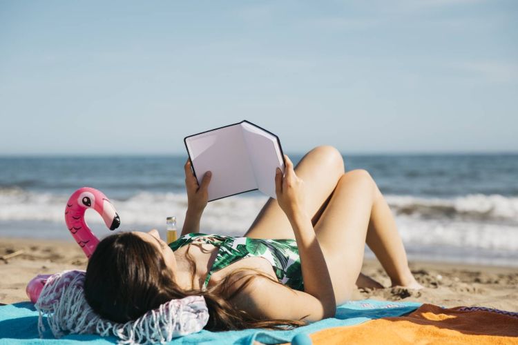 woman reading book beach 2052ddef