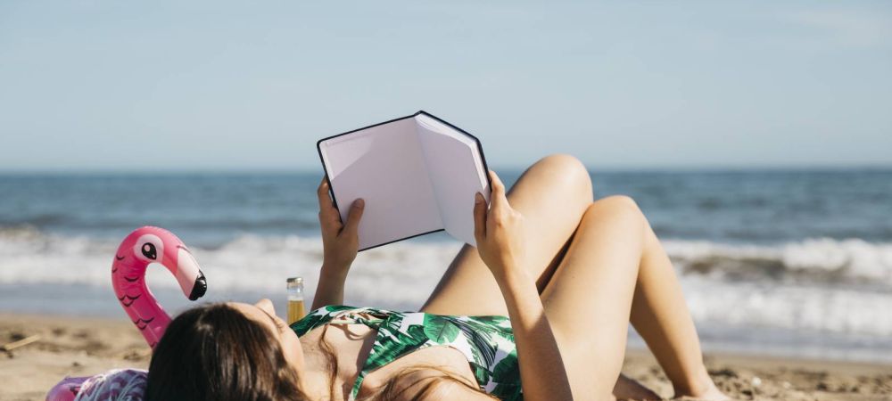 woman reading book beach 9dfc5b6c