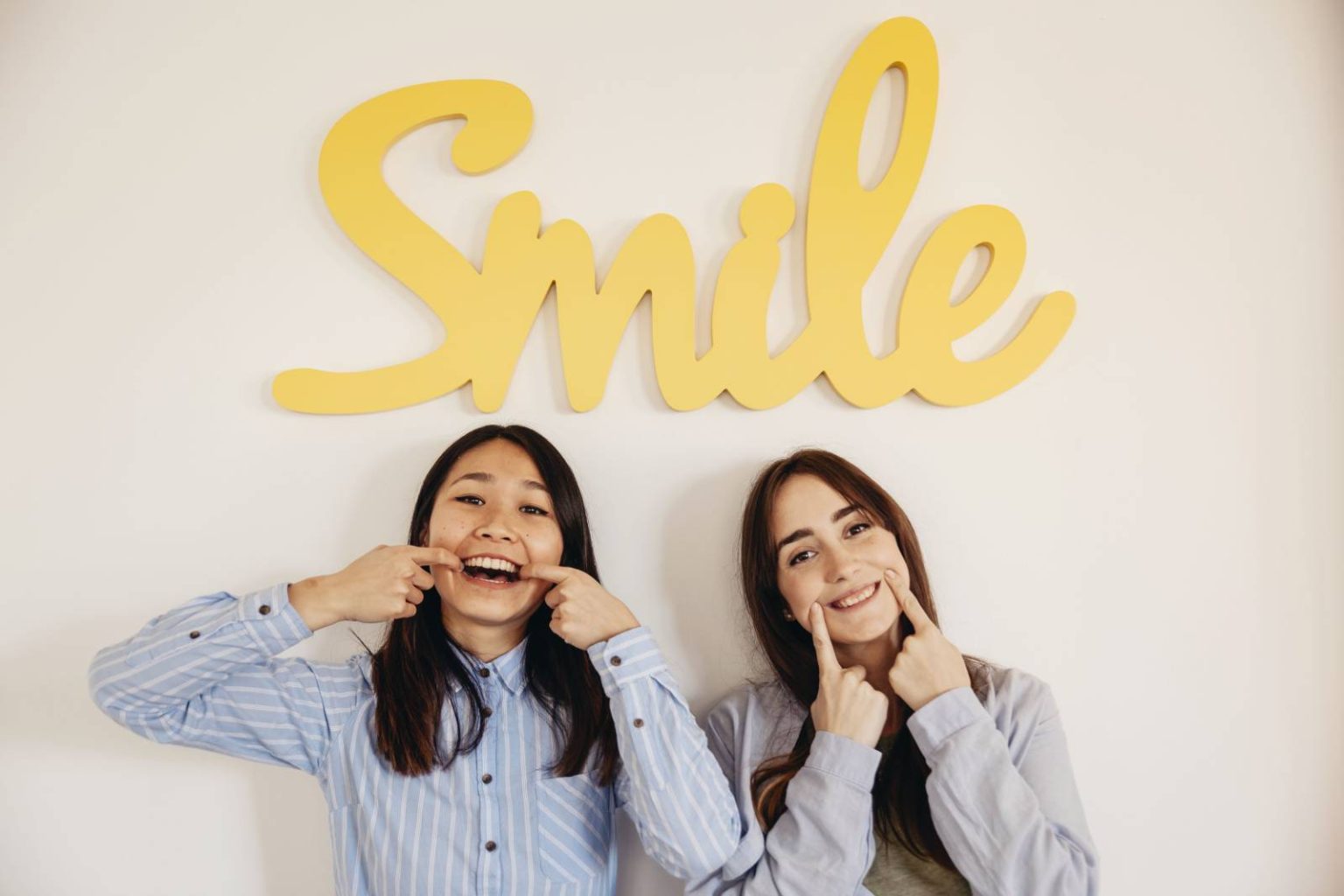 two women showing smiles